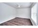 A cozy bedroom with wooden floors, white walls, and natural light from a window at 2726 Riderwood Ne Ln, Marietta, GA 30062