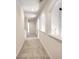 Long hallway with plush neutral carpet and archways, offering a bright and airy feel at 2726 Riderwood Ne Ln, Marietta, GA 30062