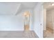 Hallway view with neutral carpet leading to a bedroom with ceiling fan at 2726 Riderwood Ne Ln, Marietta, GA 30062