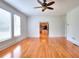 Sunlit living room boasts hardwood floors, large windows, and a neutral color scheme at 2726 Riderwood Ne Ln, Marietta, GA 30062
