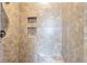 Modern shower with tiled walls, built-in shelves, and seat at 2726 Riderwood Ne Ln, Marietta, GA 30062