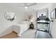 Bright bedroom features a twin bed and treadmill at 3065 Foxhall Overlook, Roswell, GA 30075