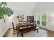 Cozy dining room with modern decor, natural light, and dark wood flooring at 3065 Foxhall Overlook, Roswell, GA 30075