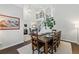 Dining room with dark wood floors, modern staircase, and ample natural light at 3065 Foxhall Overlook, Roswell, GA 30075