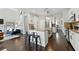 Open kitchen features modern stainless steel appliances, granite countertops, and hardwood floors at 3065 Foxhall Overlook, Roswell, GA 30075