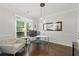 Bright home office features large windows, dark wood floors, and an accent mirror at 3065 Foxhall Overlook, Roswell, GA 30075