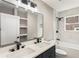 Stylish bathroom featuring a double sink vanity, modern fixtures, and a shower-tub combination at 1283 Beecher Sw St, Atlanta, GA 30310