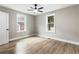 Bright bedroom features hardwood floors, windows, and neutral walls creating a serene atmosphere at 1283 Beecher Sw St, Atlanta, GA 30310