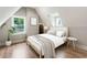 Cozy bedroom featuring hardwood floors, natural light from two windows and neutral decor at 1283 Beecher Sw St, Atlanta, GA 30310
