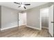 Spacious bedroom with hardwood floors, neutral walls, and a walk-in closet at 1283 Beecher Sw St, Atlanta, GA 30310