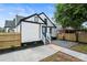 Charming home with a painted brick exterior, new landscaping, and a fenced yard at 1283 Beecher Sw St, Atlanta, GA 30310