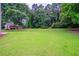 Expansive, well-maintained backyard with trees at 157 Hambrick Dr, Stockbridge, GA 30281