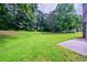 Expansive backyard with lush lawn and mature trees at 157 Hambrick Dr, Stockbridge, GA 30281
