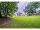 View of the home and backyard from the back of the property at 157 Hambrick Dr, Stockbridge, GA 30281
