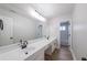Modern bathroom with double vanity, large mirror, and stylish wood-look flooring at 157 Hambrick Dr, Stockbridge, GA 30281