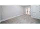 Bright bedroom with soft carpet and double glass doors leading to additional living space at 157 Hambrick Dr, Stockbridge, GA 30281