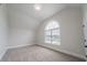 Vaulted ceiling bedroom with a arched window providing abundant natural light at 157 Hambrick Dr, Stockbridge, GA 30281