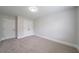 Bedroom featuring neutral walls, plush carpet, and closet space at 157 Hambrick Dr, Stockbridge, GA 30281