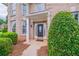 Inviting front porch with a decorative front door and manicured bushes at 157 Hambrick Dr, Stockbridge, GA 30281
