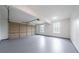Spacious two car garage with freshly painted floor and walls and natural light from two windows at 157 Hambrick Dr, Stockbridge, GA 30281