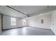 Spacious garage with painted floors, and electrical panel on the back wall at 157 Hambrick Dr, Stockbridge, GA 30281