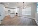 Modern kitchen with white cabinets, a black countertop island and stainless steel appliances at 157 Hambrick Dr, Stockbridge, GA 30281