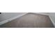 Empty room with carpeted floors and white trim at 157 Hambrick Dr, Stockbridge, GA 30281