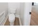 Modern toilet room with neutral walls and wood-look flooring at 157 Hambrick Dr, Stockbridge, GA 30281