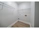 Functional walk-in closet with wood-look flooring and ample storage on wire shelves at 157 Hambrick Dr, Stockbridge, GA 30281