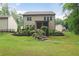 Charming backyard with lush greenery, stone steps, and well-maintained lawn at 2630 Timler Trce, Snellville, GA 30078