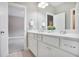 Bright bathroom featuring a dual sink vanity with modern fixtures and neutral color palette at 2630 Timler Trce, Snellville, GA 30078