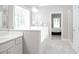 Bright bathroom featuring a tub, vanity, and a view into the bedroom at 2630 Timler Trce, Snellville, GA 30078