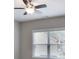 Cozy bedroom featuring a ceiling fan, large window offering great outdoor views at 2630 Timler Trce, Snellville, GA 30078