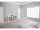 Bright bedroom with a white bed, closet, and window for a light and airy feel at 2630 Timler Trce, Snellville, GA 30078