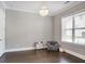 Bright bedroom with a chandelier, chair, and bookshelf; naturally lit by a large window at 2630 Timler Trce, Snellville, GA 30078