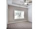 Neutral bedroom featuring a large window, baseboard trim, and an empty canvas to personalize at 2630 Timler Trce, Snellville, GA 30078