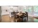 Charming dining area adjacent to the kitchen with seating for eight at 2630 Timler Trce, Snellville, GA 30078