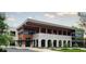 Modern stone and wood building featuring large windows and a covered walkway at 2630 Timler Trce, Snellville, GA 30078
