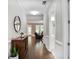 Inviting hallway featuring hardwood floors and leading into a spacious living area at 2630 Timler Trce, Snellville, GA 30078