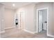 Spacious hallway with neutral carpet and paint, offering access to various rooms at 2630 Timler Trce, Snellville, GA 30078
