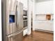 Contemporary kitchen featuring stainless steel appliances, white cabinets, and dark hardwood floors at 2630 Timler Trce, Snellville, GA 30078