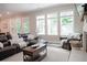 Comfortable living room with a leather sectional sofa, cozy seating and a view of the fireplace at 2630 Timler Trce, Snellville, GA 30078