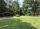Park area with covered picnic tables, playground and grassy area for recreation at 2630 Timler Trce, Snellville, GA 30078