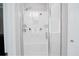 Modern shower with white tile and a glass enclosure for a spa-like experience at 2630 Timler Trce, Snellville, GA 30078