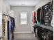 Well-organized walk-in closet with ample shelving and hanging space for clothing and accessories at 2630 Timler Trce, Snellville, GA 30078
