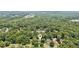 A home is nestled in a maturely wooded neighborhood, offering both privacy and community at 3267 Remembrance Trce, Lawrenceville, GA 30044