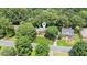 A view of a home with a well-manicured lawn, located in a neighborhood with mature trees at 3267 Remembrance Trce, Lawrenceville, GA 30044