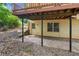 Backyard patio area, featuring a door leading to a multi-level home with a wooden deck at 3267 Remembrance Trce, Lawrenceville, GA 30044