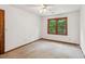 Comfortable bedroom featuring neutral walls and a window overlooking the backyard at 3267 Remembrance Trce, Lawrenceville, GA 30044