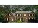 Charming two-story brick home featuring well-manicured landscaping and a welcoming front entrance at 3267 Remembrance Trce, Lawrenceville, GA 30044